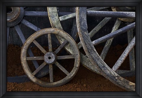 Framed Rustic wagon wheels on movie set, Cuba Print