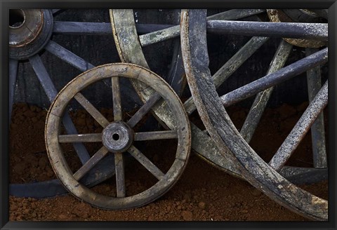 Framed Rustic wagon wheels on movie set, Cuba Print