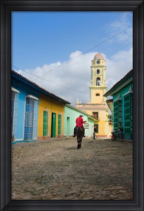 Framed Cobblestone street with cowboy on horse, Trinidad, Cuba Print