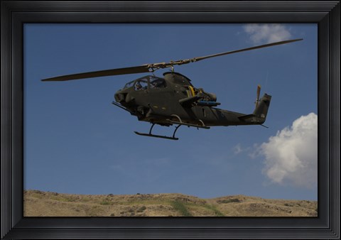Framed AH-1F Tzefa of the Israeli Air Force flying over the Golan Heights, Israel Print