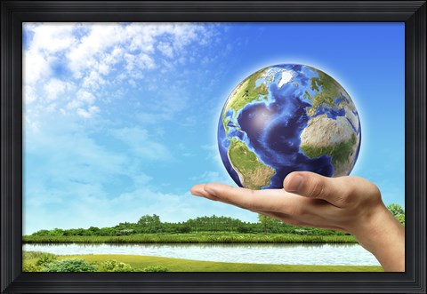 Framed Human Hand Holding Earth Globe with a Green Landscape Background Print