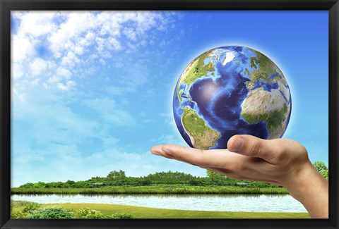 Framed Human Hand Holding Earth Globe with a Green Landscape Background Print