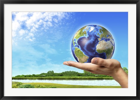 Framed Human Hand Holding Earth Globe with a Green Landscape Background Print