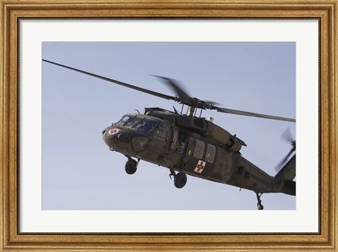 Framed UH-60 Blackhawk Medivac helicopter flies over Camp Warhorse Print
