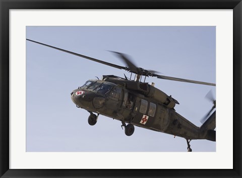 Framed UH-60 Blackhawk Medivac helicopter flies over Camp Warhorse Print