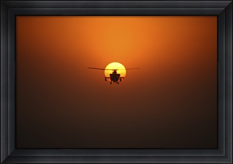 Framed AH-64D Apache Helicopter Flying into the Sun over Iraq Print
