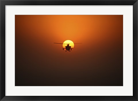 Framed AH-64D Apache Helicopter Flying into the Sun over Iraq Print