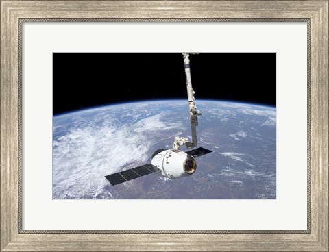 Framed SpaceX Dragon Cargo Craft in the Grasp of the Canadarm2 Print