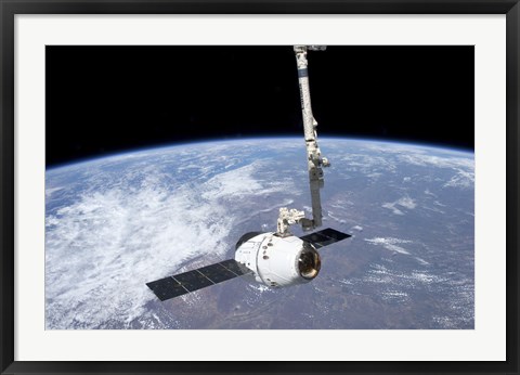 Framed SpaceX Dragon Cargo Craft in the Grasp of the Canadarm2 Print