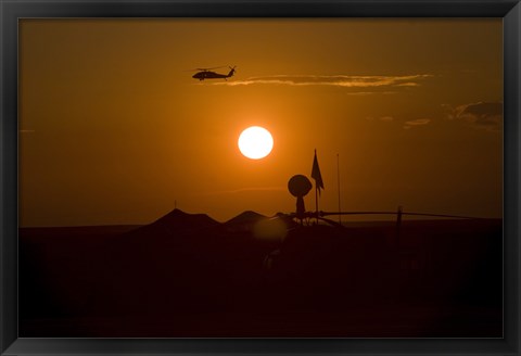 Framed UH-60 Blackhawk Flies Over Camp Speicher Airfield at Sunset Print