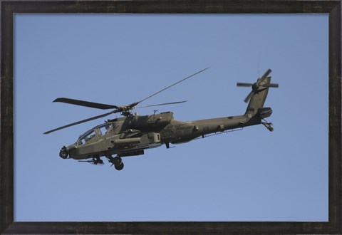 Framed AH-64 Apache in flight over the Baghdad Hotel in central Baghdad, Iraq Print