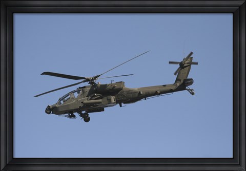 Framed AH-64 Apache in flight over the Baghdad Hotel in central Baghdad, Iraq Print