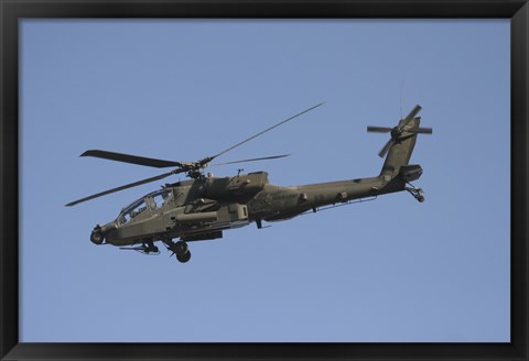 Framed AH-64 Apache in flight over the Baghdad Hotel in central Baghdad, Iraq Print