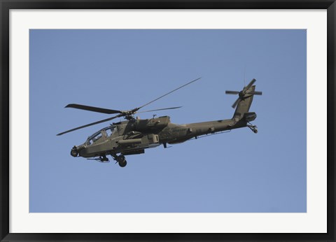 Framed AH-64 Apache in flight over the Baghdad Hotel in central Baghdad, Iraq Print