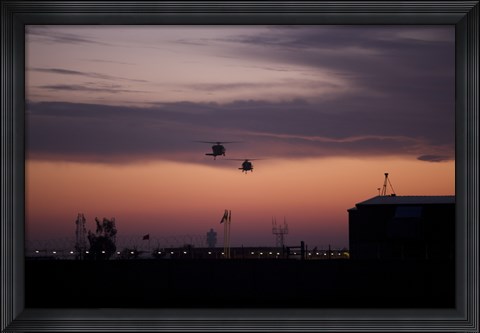Framed pair of UH-60 Black Hawk helicopters approach their Landing in Baghdad, Iraq Print