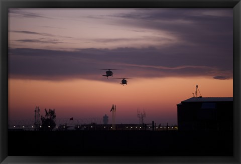 Framed pair of UH-60 Black Hawk helicopters approach their Landing in Baghdad, Iraq Print