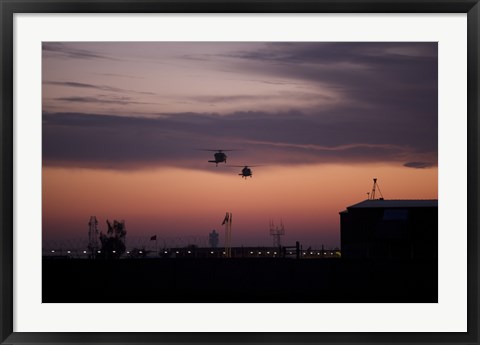 Framed pair of UH-60 Black Hawk helicopters approach their Landing in Baghdad, Iraq Print