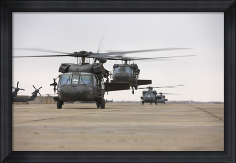 Framed UH-60 Black Hawks taxis out for a mission over northern Iraq Print