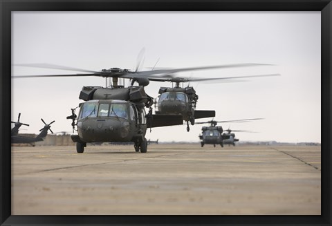 Framed UH-60 Black Hawks taxis out for a mission over northern Iraq Print