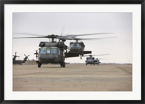 Framed UH-60 Black Hawks taxis out for a mission over northern Iraq Print