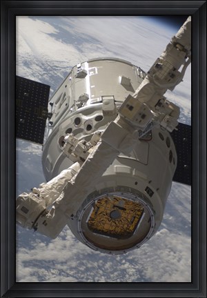 Framed SpaceX Dragon Commercial Cargo Craft during Grappling Operations with Canadarm2 Print