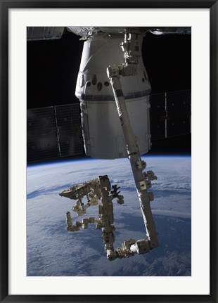 Framed SpaceX Dragon Commercial Cargo Craft Berthed to the ISS Print