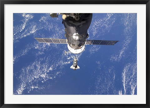 Framed Space Shuttle Discovery approaches the International Space Station Print