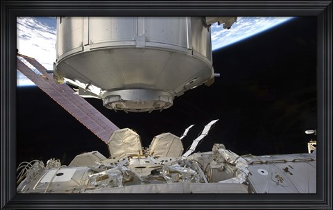 Framed Multipurpose Module in the grasp of Canadarm2 Print