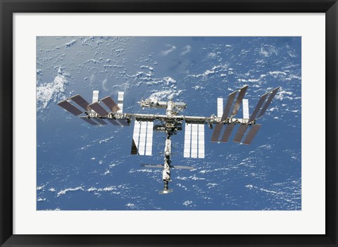 Framed International Space Station Backdropped by a Blue and White Part of Earth Print