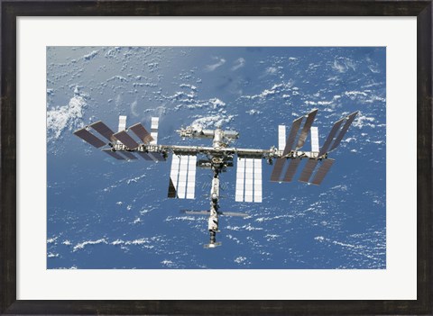 Framed International Space Station Backdropped by a Blue and White Part of Earth Print