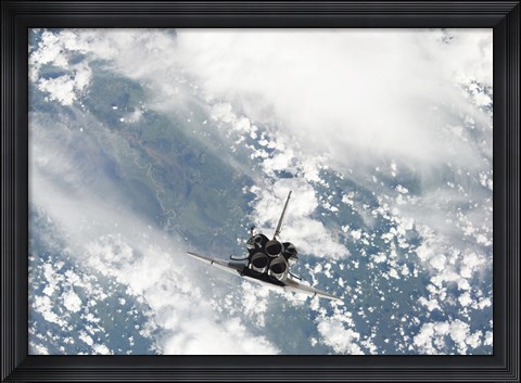 Framed Rear view of the Three main Engines of Space Shuttle Discovery as the Shuttle approaches the International Space Station Print