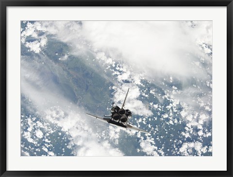 Framed Rear view of the Three main Engines of Space Shuttle Discovery as the Shuttle approaches the International Space Station Print