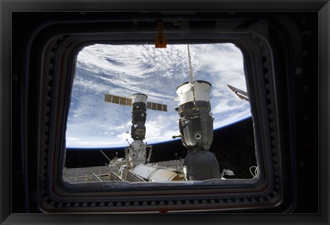 Framed Two Russian Spacecraft Docked with the International Space Station, as seen from Space Shuttle Discovery&#39;s Flight Deck Window Print