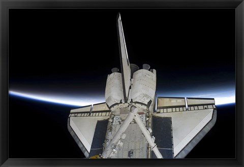 Framed Space Shuttle Discovery Intersecting the Thin line of Earth&#39;s Atmosphere, while Docked with the International Space Station Print