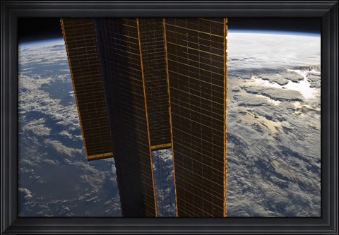 Framed Solar Panels of the International Space Station Backdropped by a Blue and White Earth Print