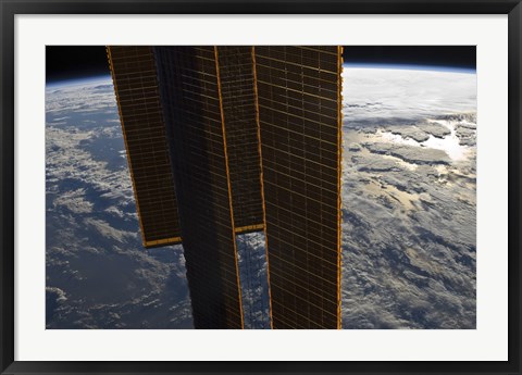 Framed Solar Panels of the International Space Station Backdropped by a Blue and White Earth Print