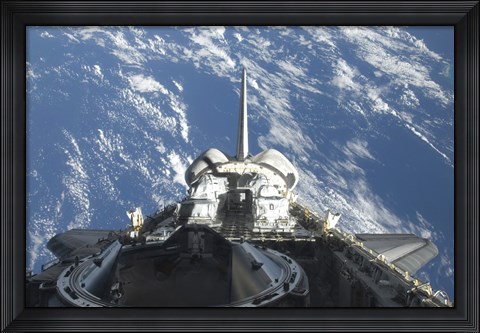 Framed partial view of Space Shuttle Atlantis Backdropped by a Blue and White Earth Print