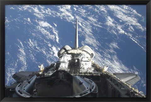 Framed partial view of Space Shuttle Atlantis Backdropped by a Blue and White Earth Print