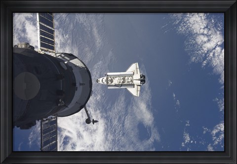Framed Space Shuttle Atlantis and a Russian Spacecraft backdropped by a Blue and White Earth Print