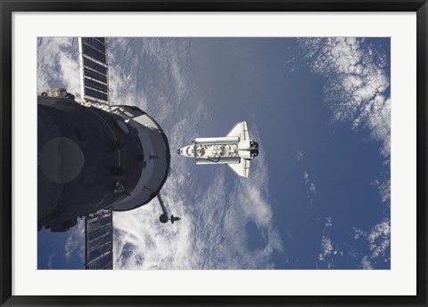 Framed Space Shuttle Atlantis and a Russian Spacecraft backdropped by a Blue and White Earth Print