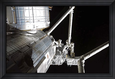 Framed Robotic Arm of the Japanese Experiment Module assists in installing components on the Japanese Exposed Facility Print