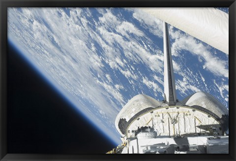 Framed Partial view of Space Shuttle Endeavour Backdropped against Earth Print