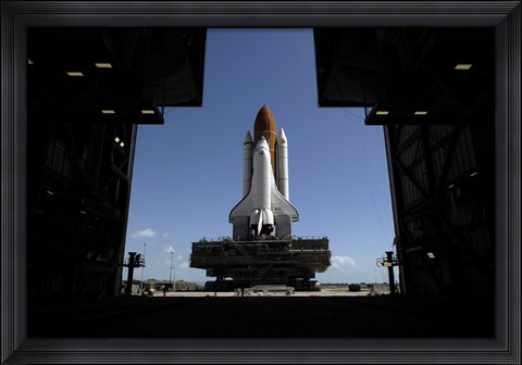 Framed Atlantis Rolls Toward the Open Doors of the Vehicle Assembly Building at Kennedy Space Center Print