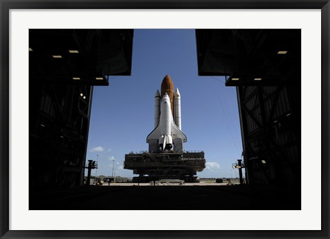 Framed Atlantis Rolls Toward the Open Doors of the Vehicle Assembly Building at Kennedy Space Center Print