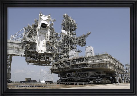 Framed mobile Launcher Platform is being moved via the Crawler-Transporter Underneath Print