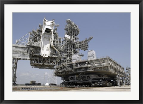 Framed mobile Launcher Platform is being moved via the Crawler-Transporter Underneath Print