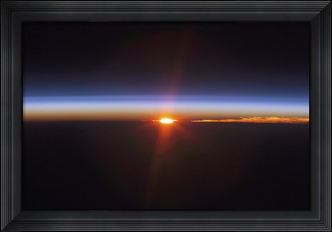 Framed Layers of Earth&#39;s atmosphere, brightly colored as the sun sets over South America Print