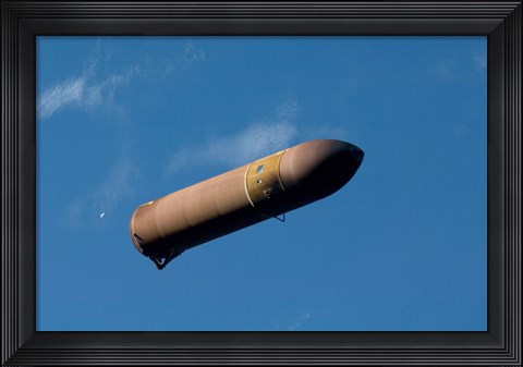 Framed External Fuel Tank Backdropped by a Blue and White Part of Earth Print