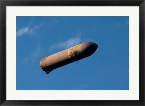 Framed External Fuel Tank Backdropped by a Blue and White Part of Earth Print
