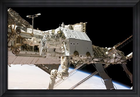 Framed Canadian-Built Dextre Robotic System in the Grasp of the Robotic Canadarm2 Print
